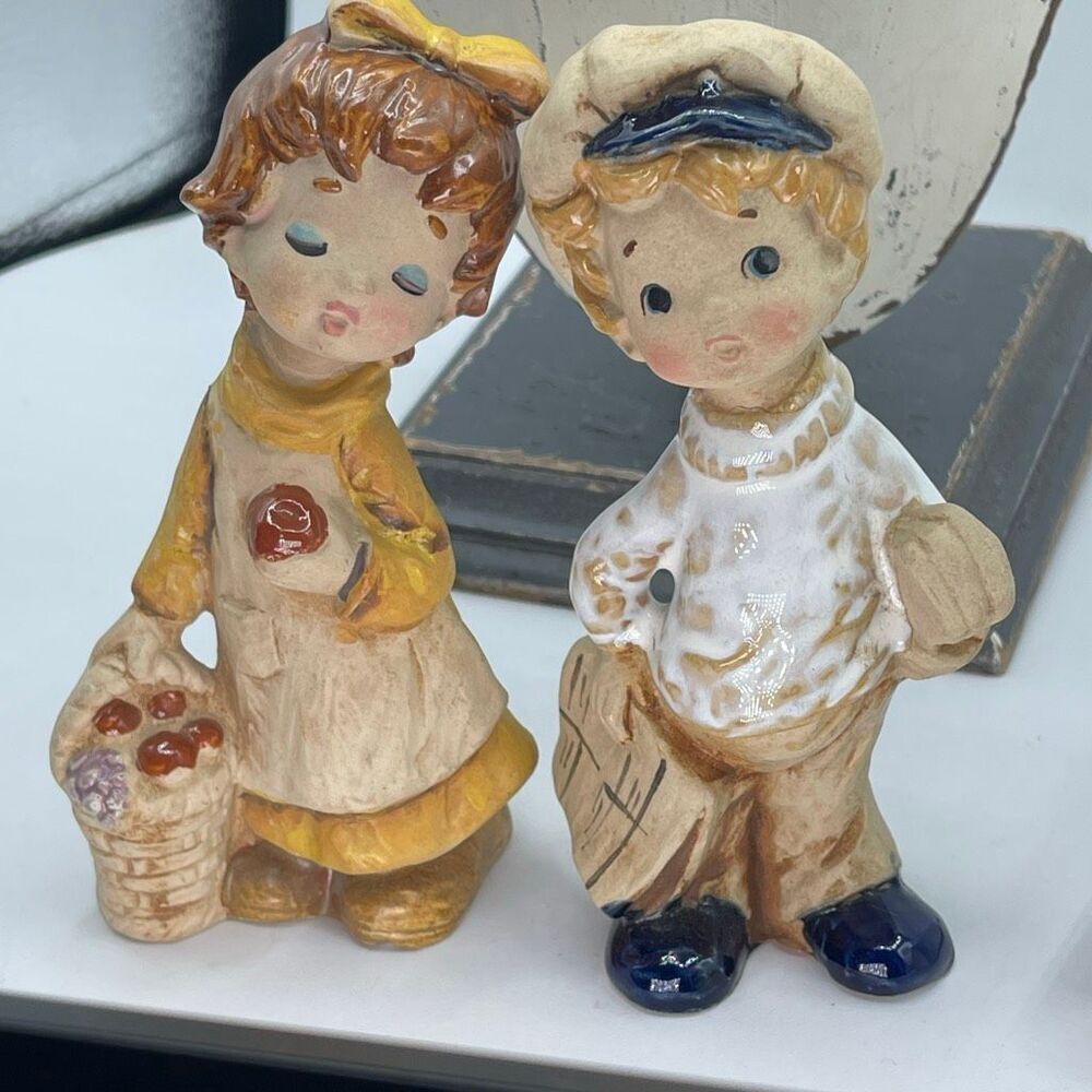 Vintage Lefton ceramic figurines boy newspaper & girl with fruit.